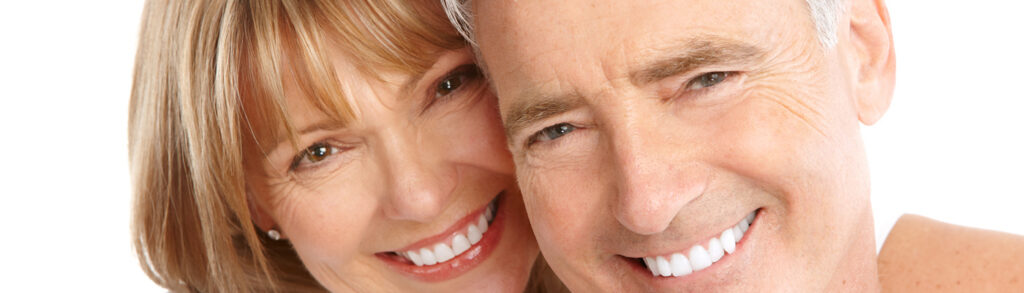 Happy elderly senior couple in love. Isolated over white background.