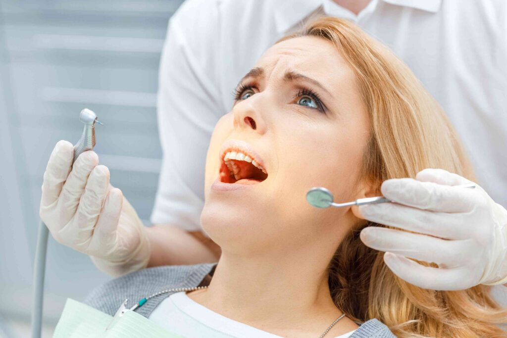 Patient receiving an emergency dental examination.